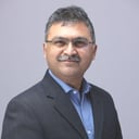 IMG-Merge-Ashish-Sant-Headshot